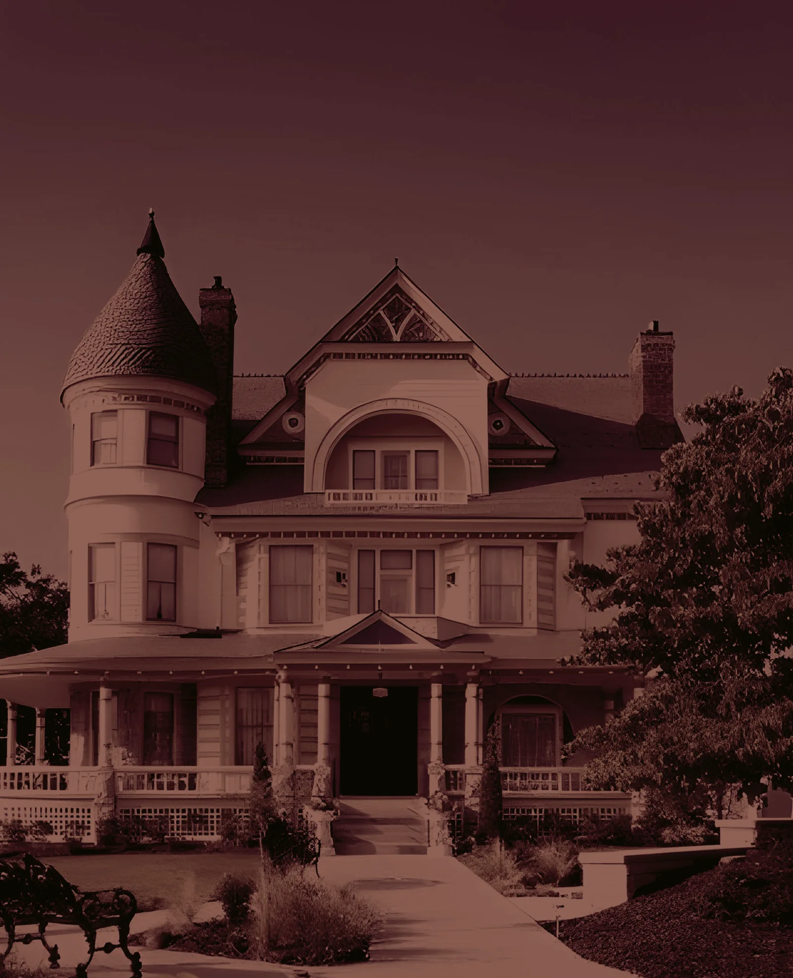The front of the house — turret, wrap-around porch and gabled dormer.